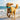 Dog running on a beach with a blue toy in its mouth
